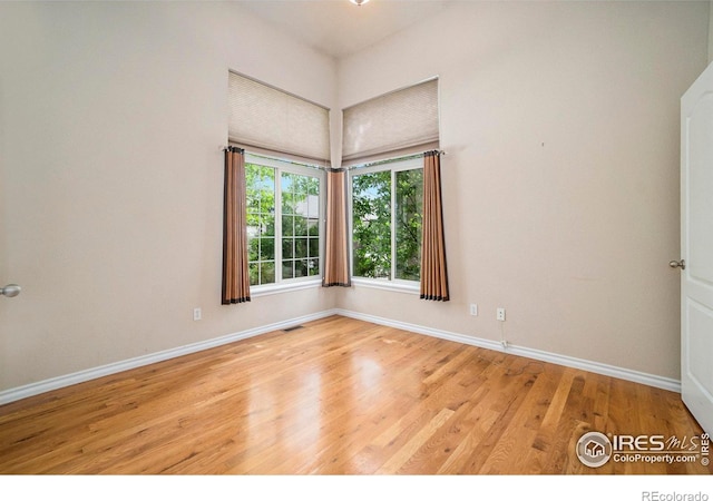 unfurnished room featuring light wood-type flooring