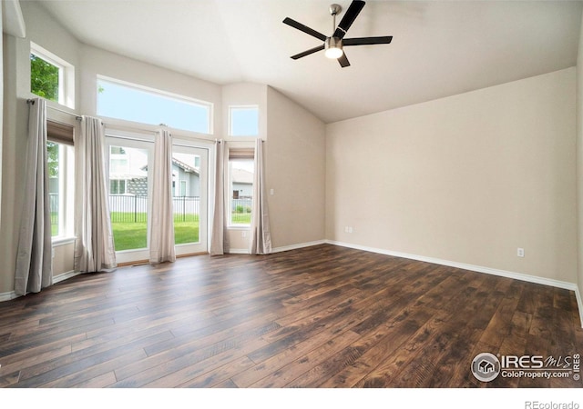 unfurnished room featuring ceiling fan, vaulted ceiling, and dark hardwood / wood-style flooring