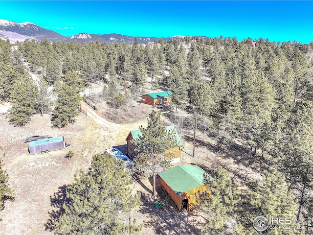 bird's eye view with a mountain view and a view of trees