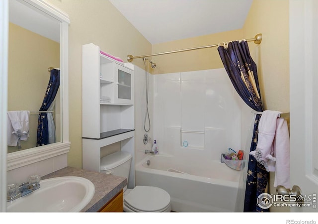 full bathroom with toilet, vanity, and shower / bathtub combination with curtain