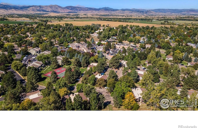 birds eye view of property with a mountain view