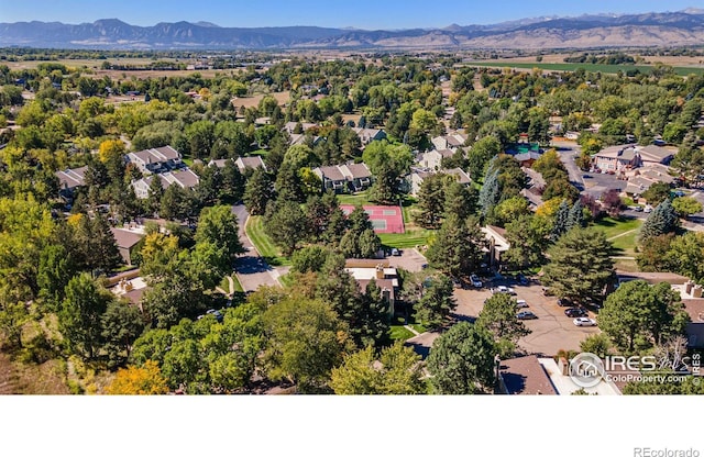 birds eye view of property featuring a mountain view