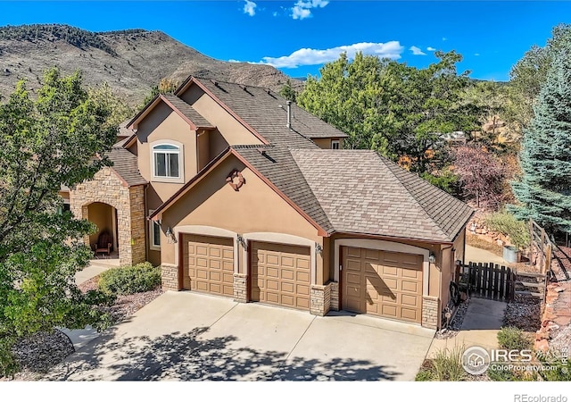 view of front of house with a mountain view and a garage