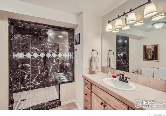 133 Eagle Canyon Cir, Lyons, CO 80540 - bathroom featuring vanity, a tile shower, and toilet