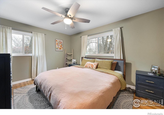 bedroom featuring ceiling fan and wood-type flooring