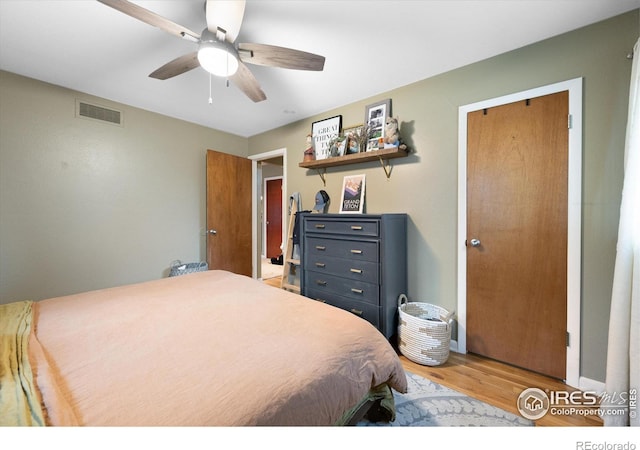 bedroom featuring hardwood / wood-style flooring and ceiling fan