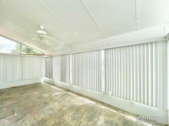 unfurnished sunroom featuring vaulted ceiling and ceiling fan