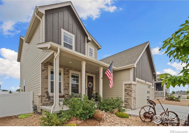 view of front of home with a garage and a porch