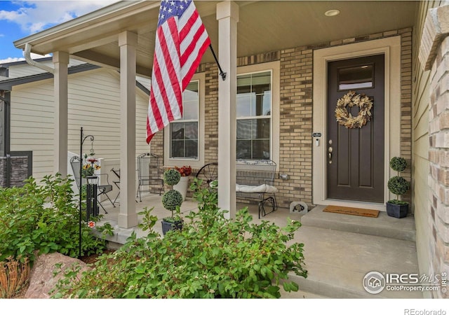 doorway to property with a porch