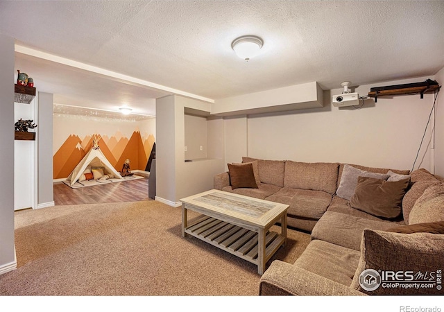 living room featuring a textured ceiling and carpet flooring