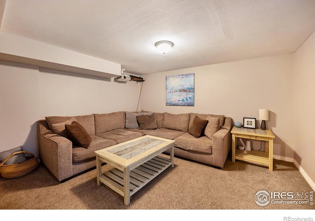 living room featuring carpet and a textured ceiling