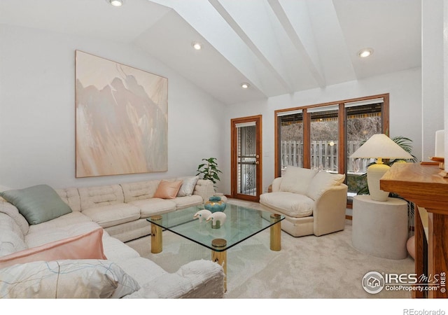 carpeted living room with vaulted ceiling