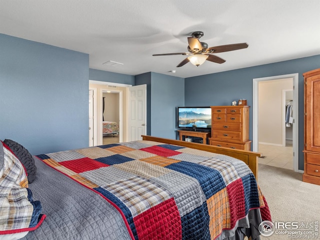 bedroom with light carpet and ceiling fan