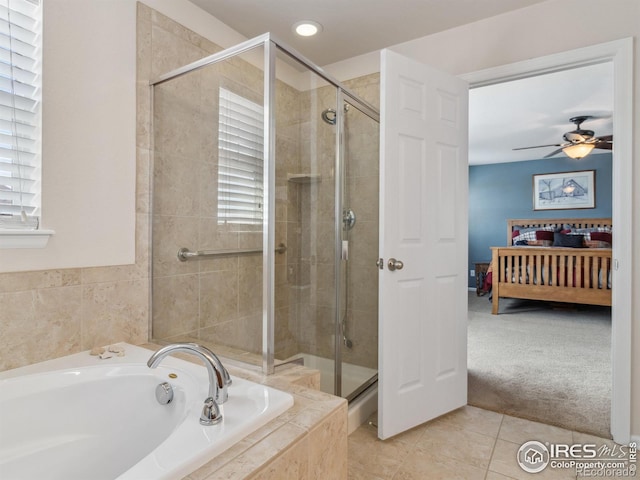 bathroom with ceiling fan, separate shower and tub, and tile patterned flooring