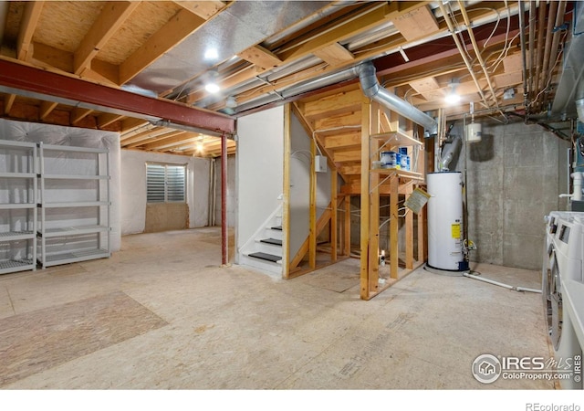 basement featuring water heater and separate washer and dryer