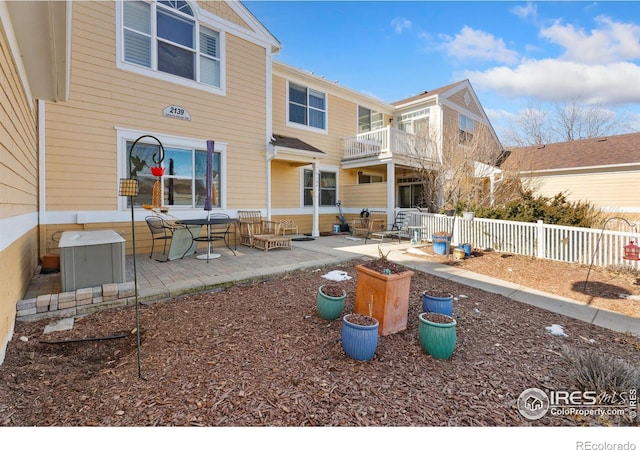 back of house with a patio