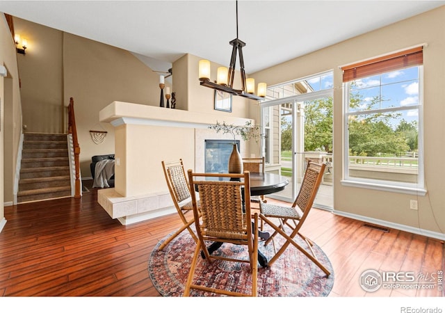 dining room featuring hardwood / wood-style flooring and a chandelier