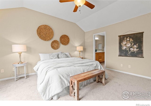 carpeted bedroom featuring lofted ceiling, connected bathroom, and ceiling fan