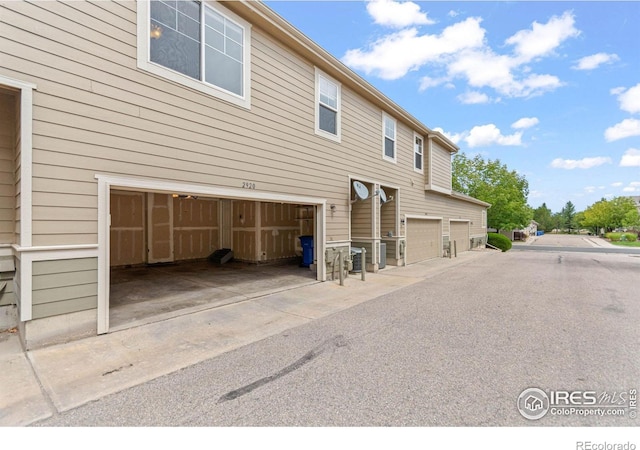 view of side of home with a garage