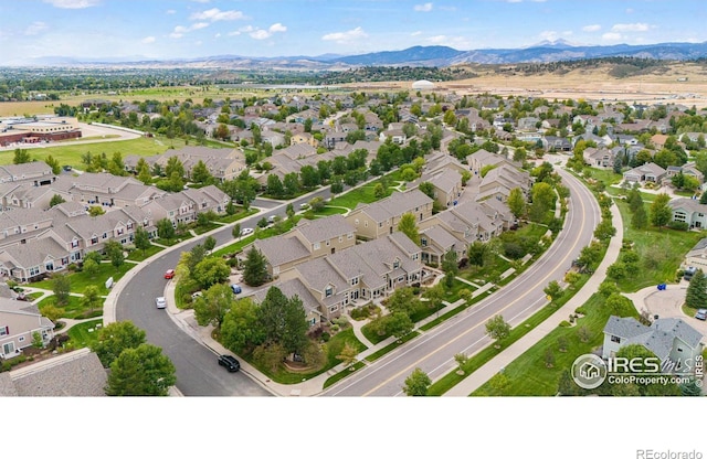 birds eye view of property with a mountain view