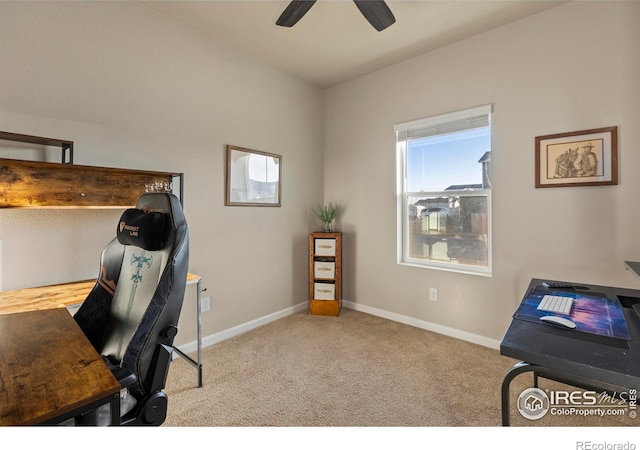 carpeted home office with ceiling fan