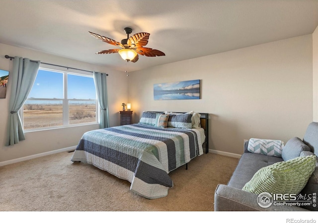 bedroom featuring ceiling fan and light carpet