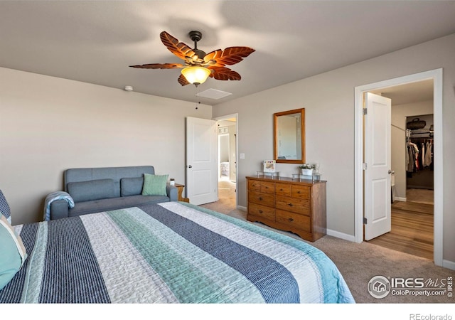 bedroom with light carpet and ceiling fan