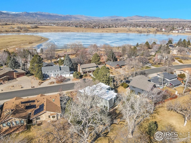 birds eye view of property featuring a residential view and a water and mountain view