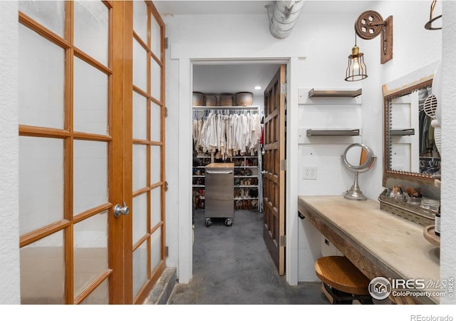 spacious closet featuring french doors