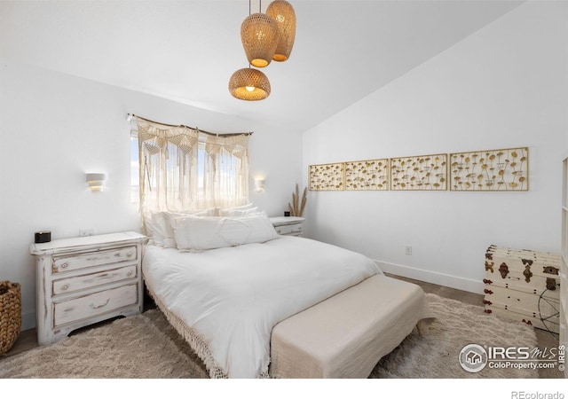 bedroom featuring vaulted ceiling