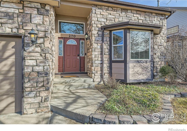 property entrance with a garage