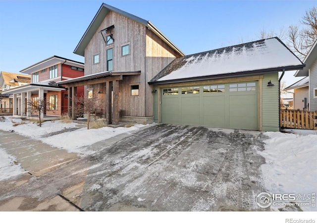 view of front of house featuring a garage and a porch