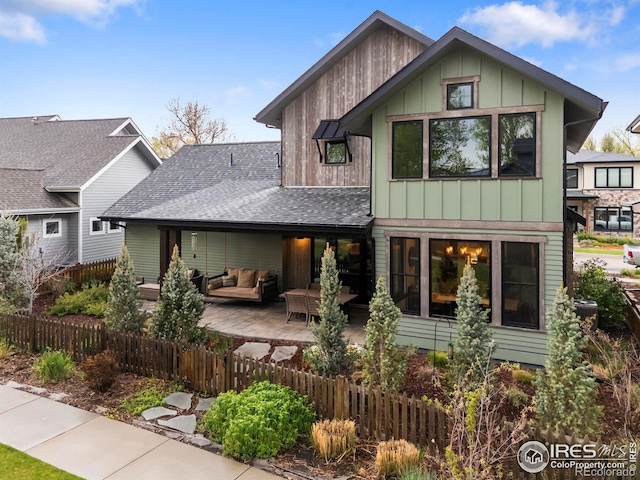 745 Harts Gardens Ln, Fort Collins, CO 80521 - view of front of home featuring an outdoor living space, a shingled roof, board and batten siding, and a patio