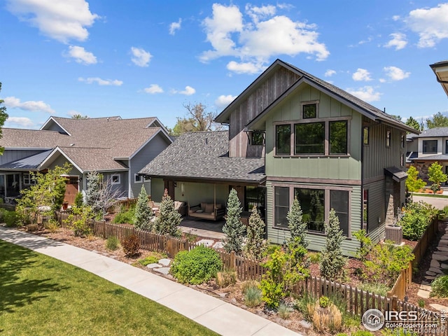 745 Harts Gardens Ln, Fort Collins, CO 80521 - view of front of house featuring board and batten siding and central AC