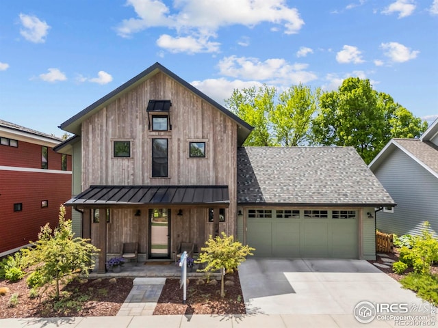 745 Harts Gardens Ln, Fort Collins, CO 80521 - view of front facade with a porch, an attached garage, board and batten siding, driveway, and a standing seam roof