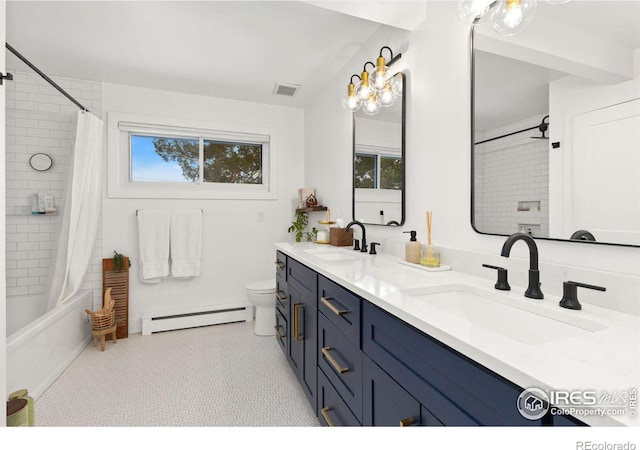 full bathroom featuring shower / bath combo, vanity, baseboard heating, and toilet