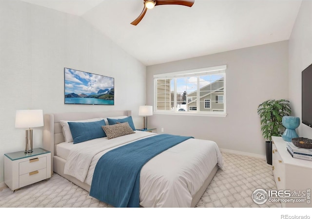 bedroom featuring lofted ceiling, baseboards, a ceiling fan, and light colored carpet