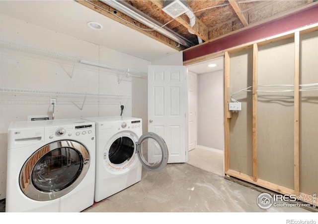 laundry room with laundry area, independent washer and dryer, and visible vents