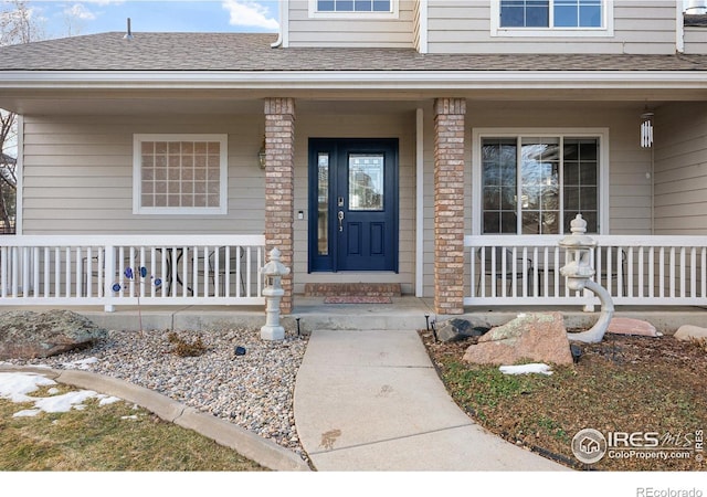 entrance to property with a porch