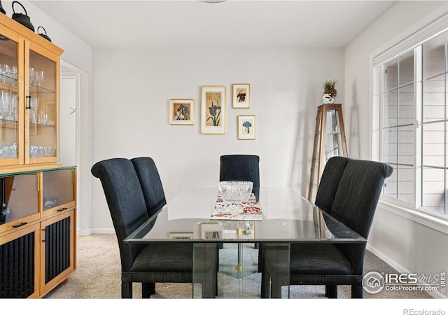 view of carpeted dining area