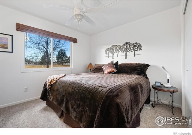 bedroom featuring light colored carpet and ceiling fan