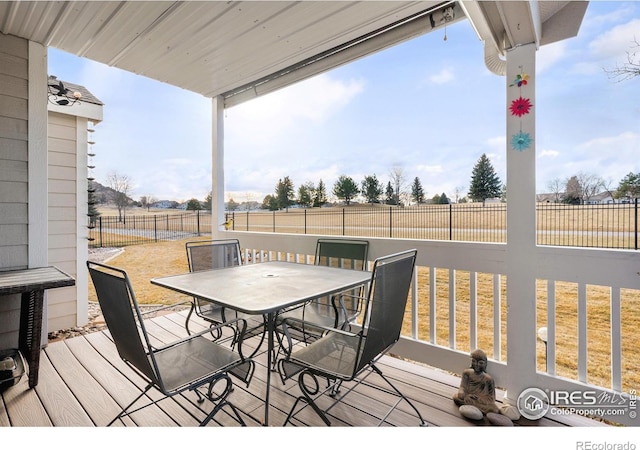 wooden deck featuring a rural view