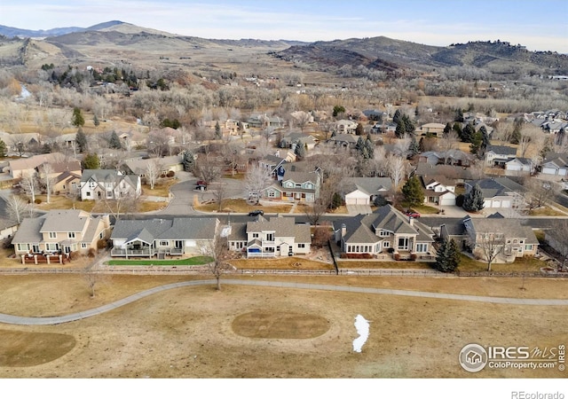 birds eye view of property featuring a mountain view