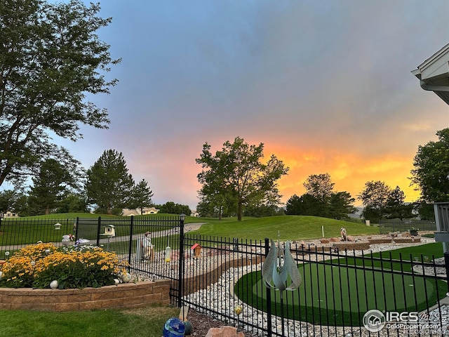 view of yard at dusk