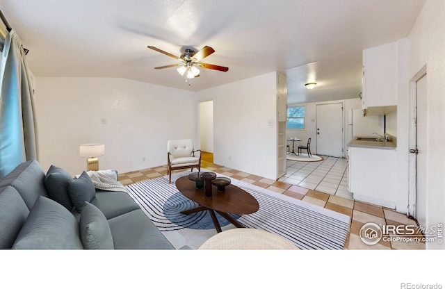 414 16th Avenue Ct, Greeley, CO 80631 - living room with a ceiling fan, light tile patterned floors, and vaulted ceiling