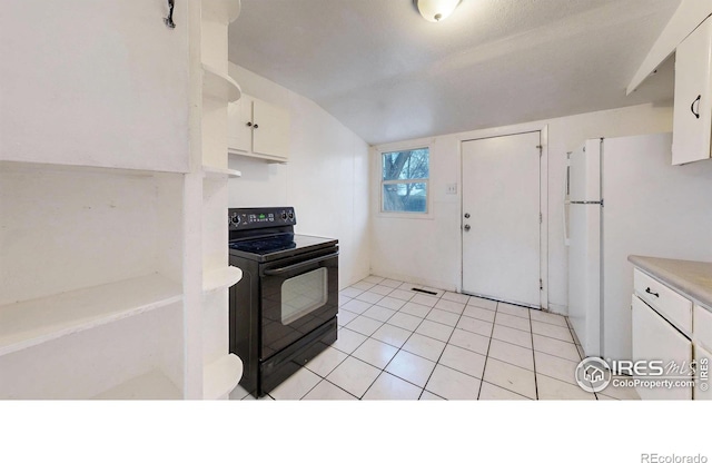 414 16th Avenue Ct, Greeley, CO 80631 - kitchen featuring black range with electric stovetop, freestanding refrigerator, white cabinets, light countertops, and lofted ceiling
