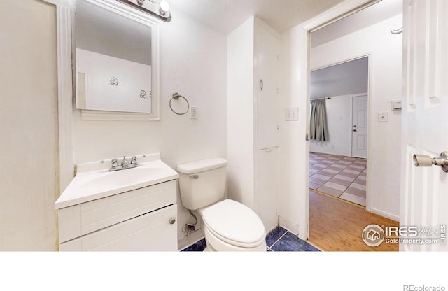 414 16th Avenue Ct, Greeley, CO 80631 - half bathroom with vanity and tile patterned flooring