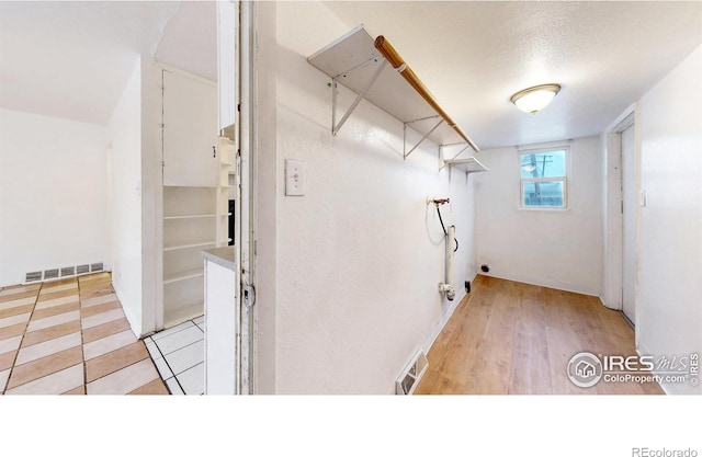 414 16th Avenue Ct, Greeley, CO 80631 - laundry area with washer hookup and light wood-style floors