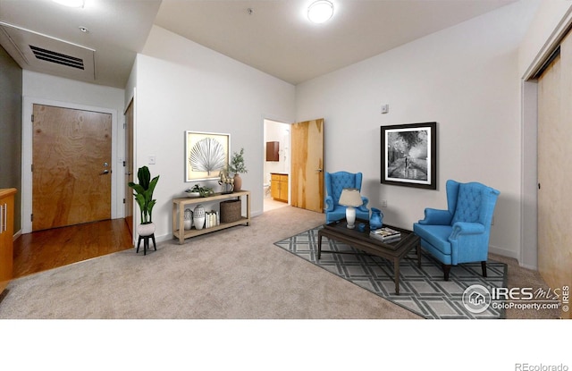 sitting room featuring carpet floors