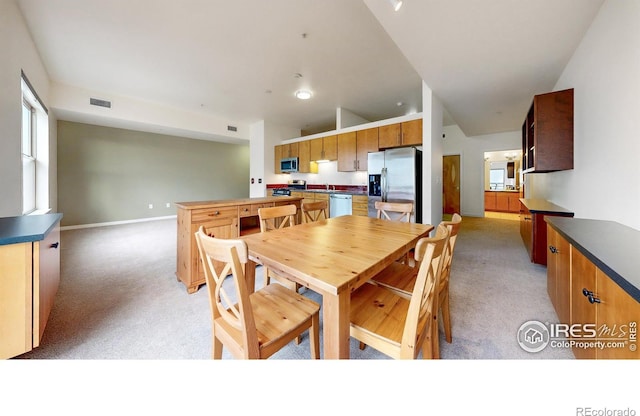 view of carpeted dining space